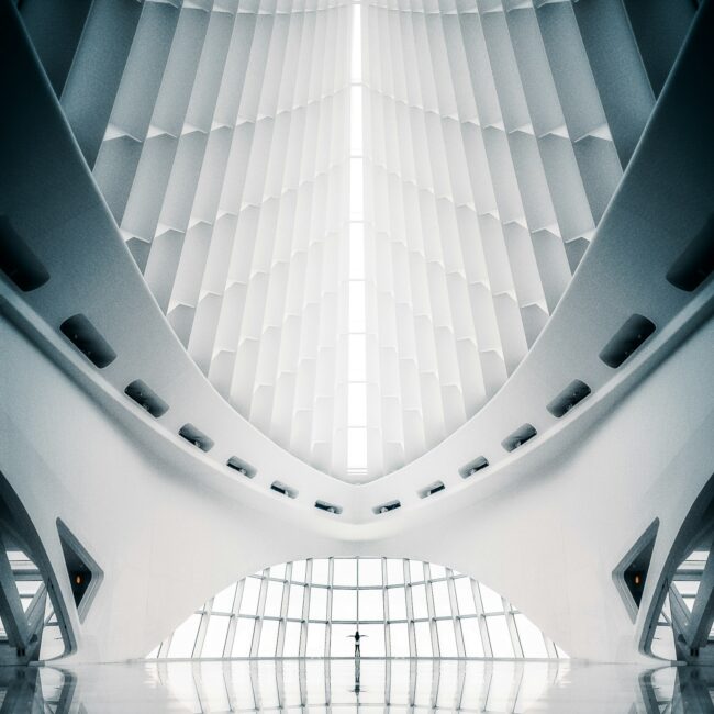 Vertical shot of the interior of a white abstract architectural building