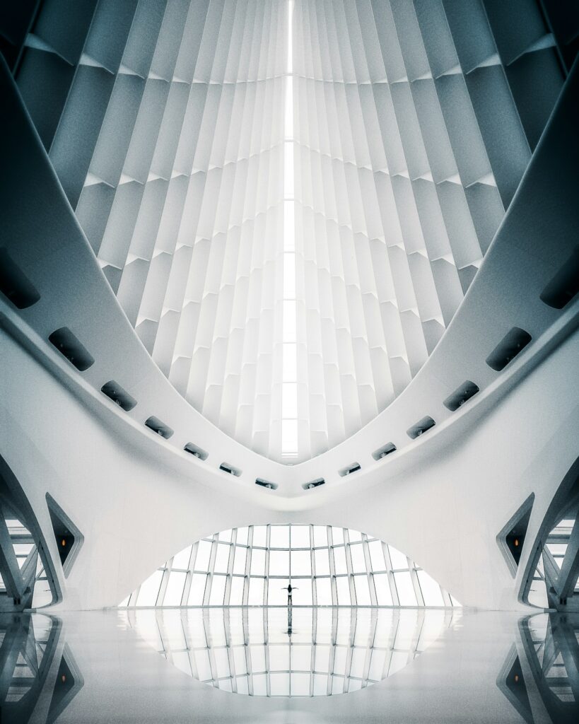 Vertical shot of the interior of a white abstract architectural building